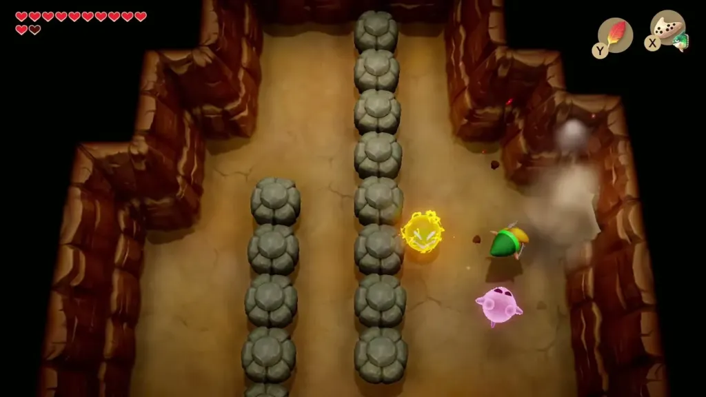 Link blows open a cracked cave wall with a Bomb as a pink Ghost floats beside him Link blows open a cracked cave wall with a Bomb as a pink Ghost floats beside him