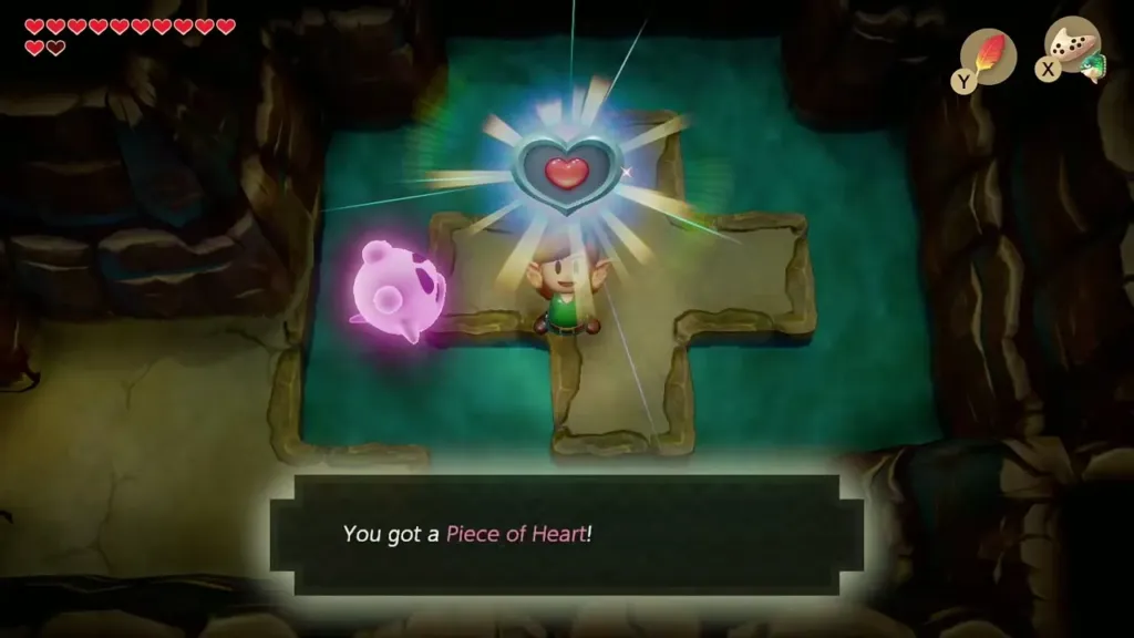 Link holds up a Piece of Heart on the cross-shaped platform with the message box shown Link holds up a Piece of Heart on the cross-shaped platform with the message box shown
