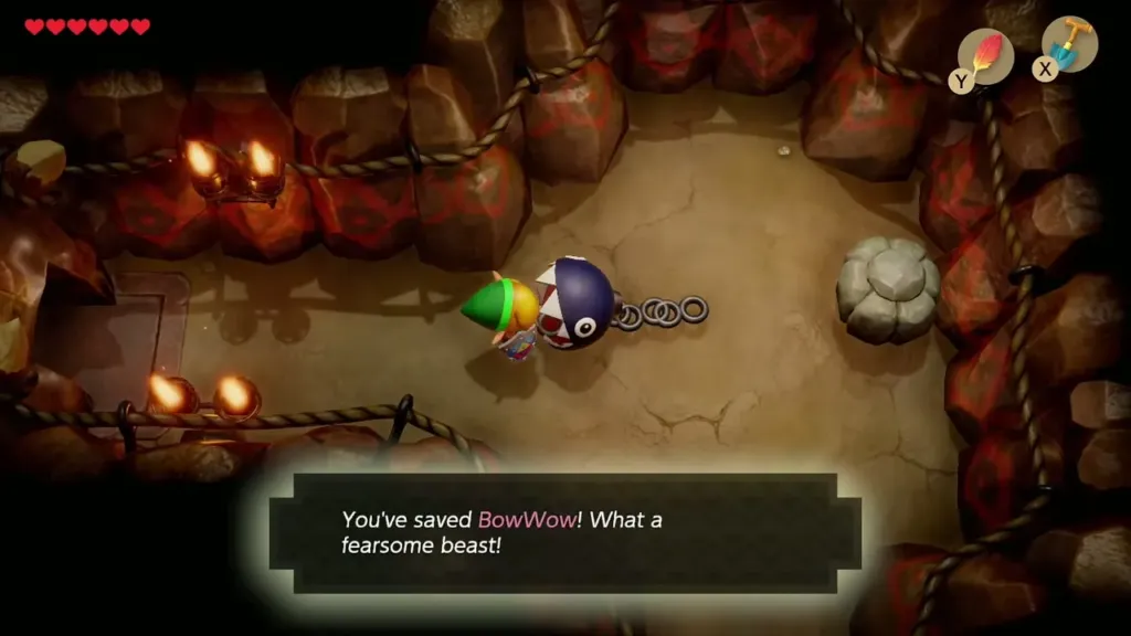 Link beside BowWow in the cave as the saved-BowWow message appears Link beside BowWow in the cave as the saved-BowWow message appears
