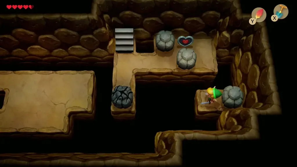 Link standing on the narrow ledge below the Piece of Heart after jumping the gap Link standing on the narrow ledge below the Piece of Heart after jumping the gap