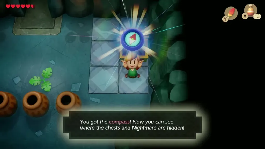 Link holding up the Compass with its name box Link holding up the Compass with its name box
