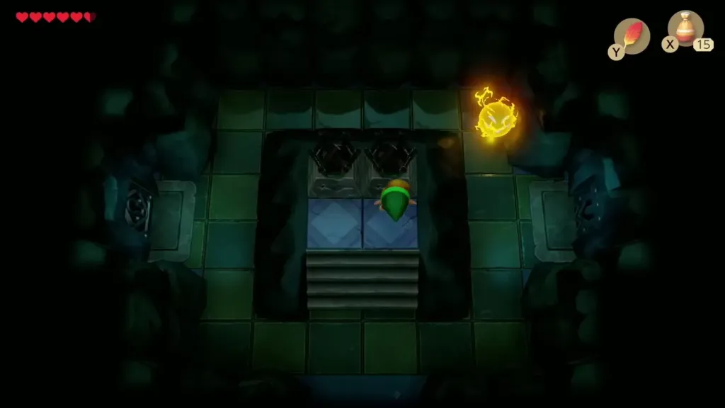 Link in the dark room facing two unlit torches above the stairs Link in the dark room facing two unlit torches above the stairs
