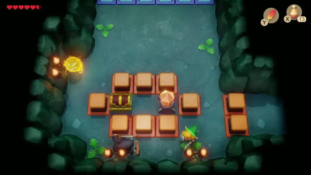 A chest ringed by orange blocks with a crystal switch beside it A chest ringed by orange blocks with a crystal switch beside it