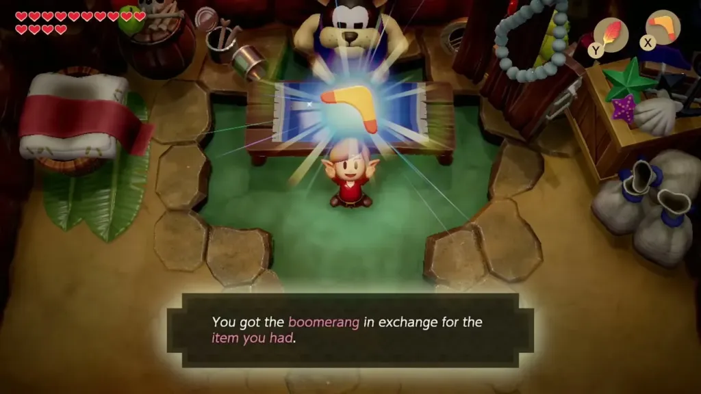 Link holding up the Boomerang with its name box in the Goriya cave Link holding up the Boomerang with its name box in the Goriya cave