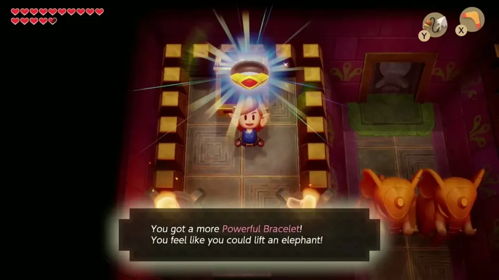Link holding up the Power Bracelet L-2 beside elephant statues Link holding up the Power Bracelet L-2 beside elephant statues