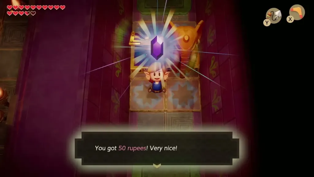 Link holding up the purple gem with the message that he got 50 rupees Link holding up the purple gem with the message that he got 50 rupees