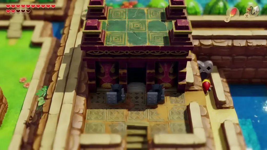 The Face Shrine standing open in the Ancient Ruins with Link beside it The Face Shrine standing open in the Ancient Ruins with Link beside it