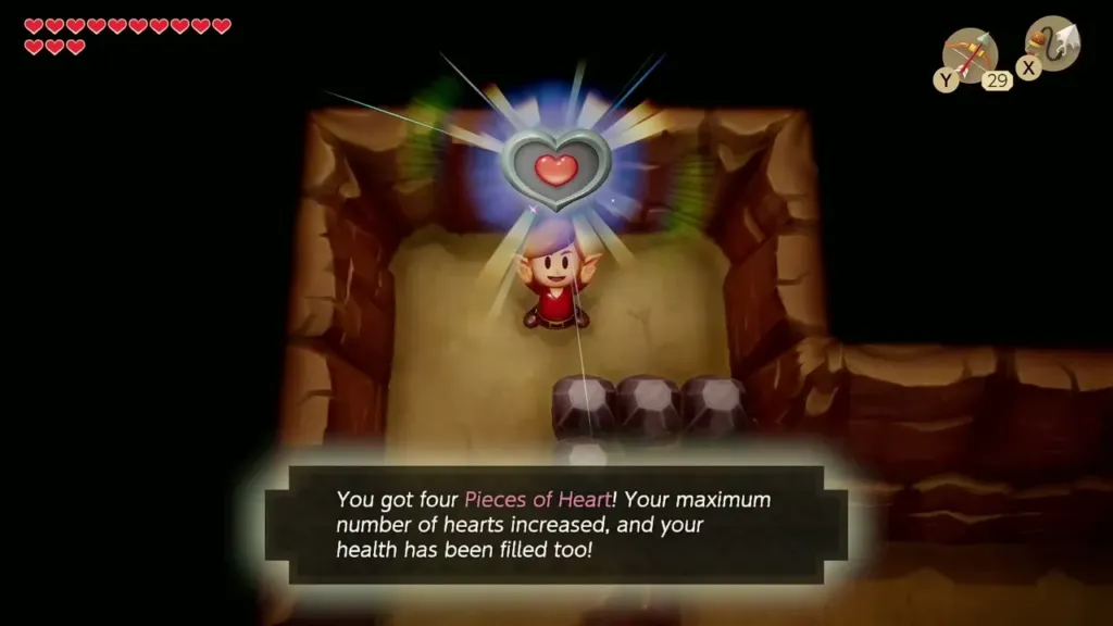 Link holding up a Piece of Heart on the ledge with the item box shown Link holding up a Piece of Heart on the ledge with the item box shown