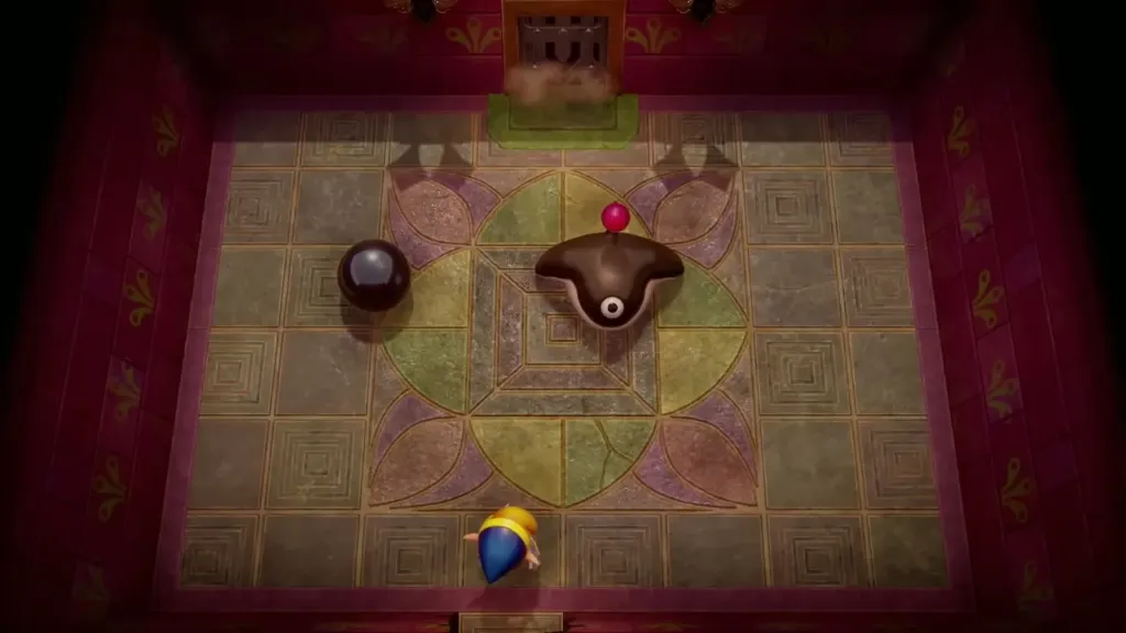 Smasher and a heavy black ball in the circular arena with Link below Smasher and a heavy black ball in the circular arena with Link below