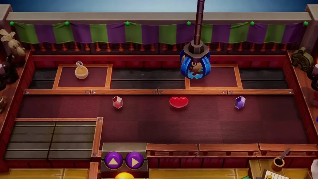 The crane claw gripping the Blooper figure at the Trendy Game The crane claw gripping the Blooper figure at the Trendy Game