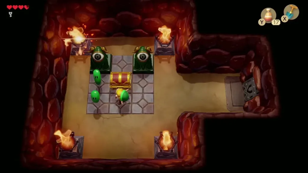 Link at the chest in the torch-lit room with green enemies Link at the chest in the torch-lit room with green enemies