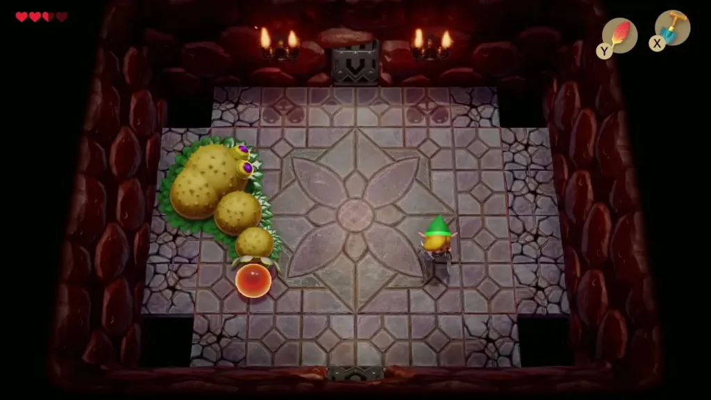 Link facing Moldorm and its glowing red tail tip in the boss room Link facing Moldorm and its glowing red tail tip in the boss room