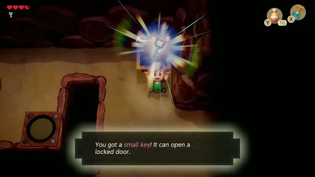 Link holding up the second Small Key with its message box Link holding up the second Small Key with its message box