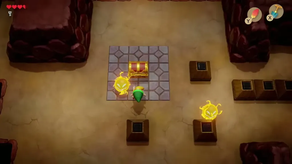 A Spark circling the chest on its tile platform in Tail Cave A Spark circling the chest on its tile platform in Tail Cave