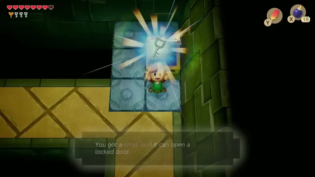 Link holding up a small key in a blue-tile room