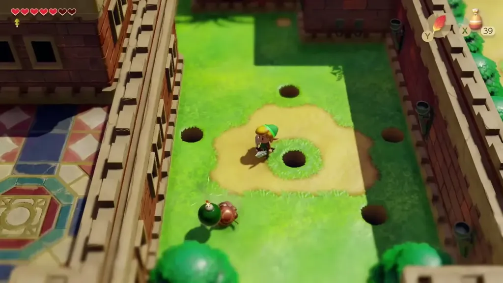 Link in the courtyard with a Mad Bomber near the holes