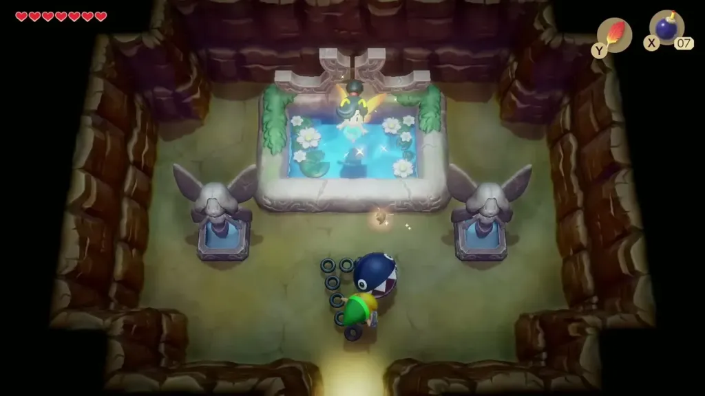 Fairies hovering over the fountain pool as Link walks in