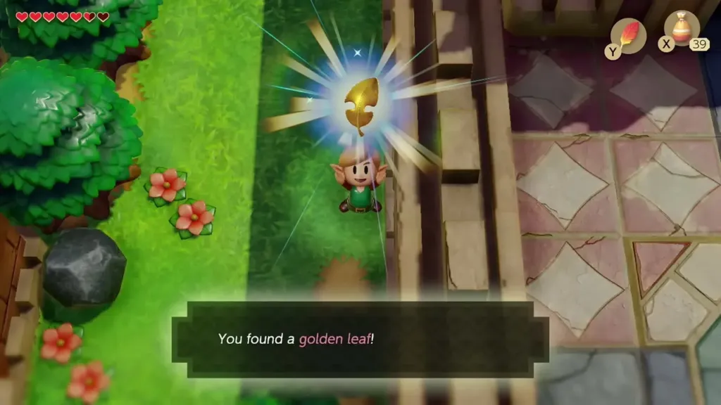 Link holding up a Golden Leaf on the west castle wall path, with the item message on screen