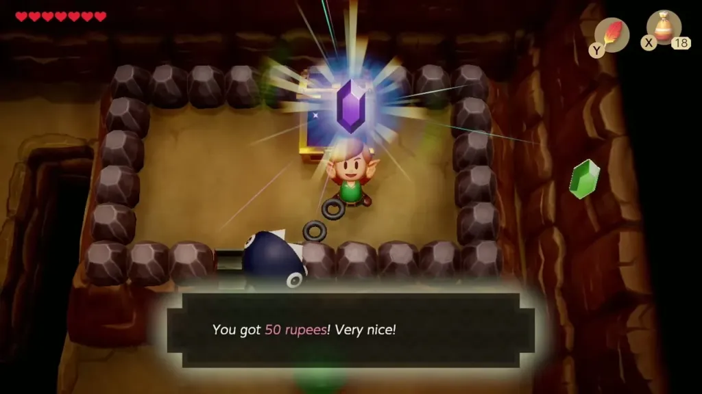 Link holding up a purple rupee from the cave chest, with the 50 rupee message on screen