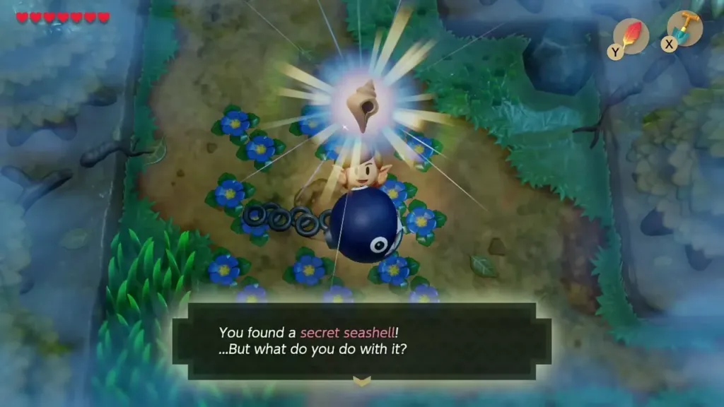 Link holding up a Secret Seashell dug up among the blue flowers, with the item message on screen