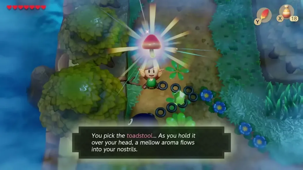 Link holding up the red Sleepy Toadstool picked in the forest, with its message on screen
