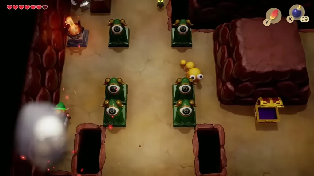 A bomb blast at the cracked left wall of the long central room in Tail Cave