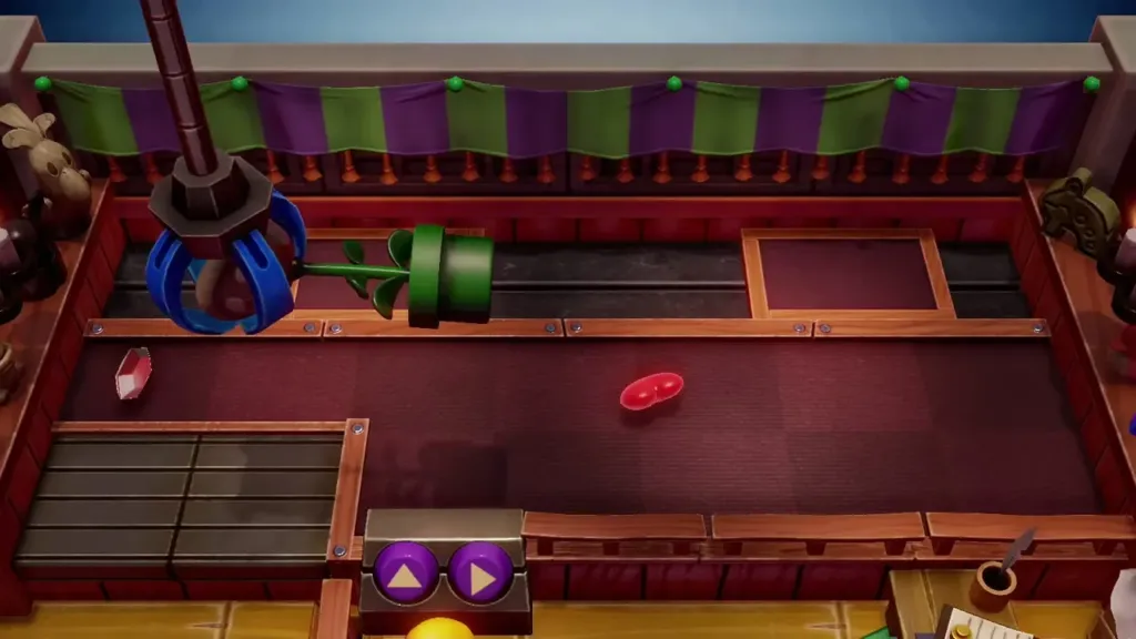 Claw gripping the Piranha Plant on its way to the prize chute Claw gripping the Piranha Plant on its way to the prize chute