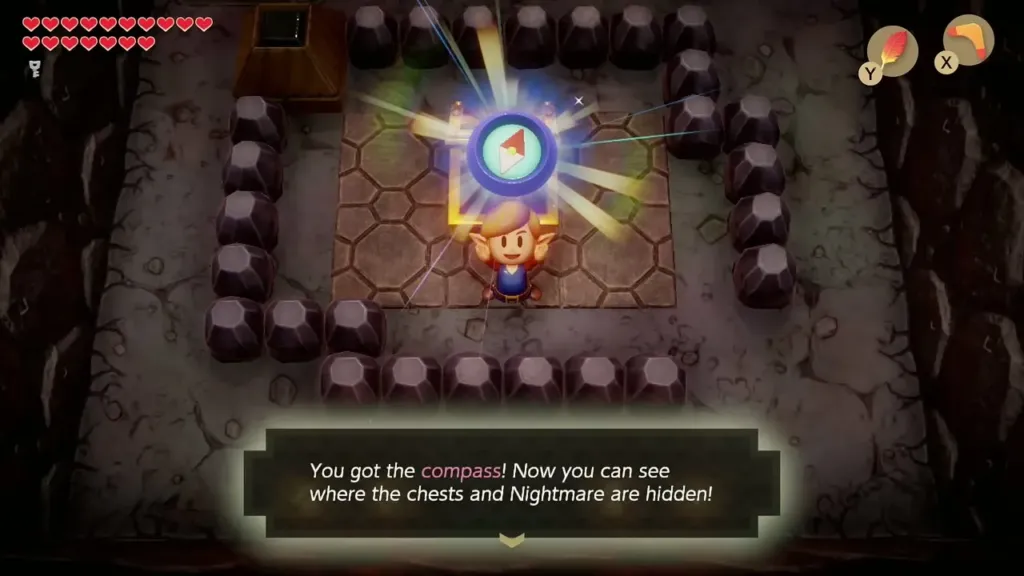 Link holding up the Compass with its message box Link holding up the Compass with its message box