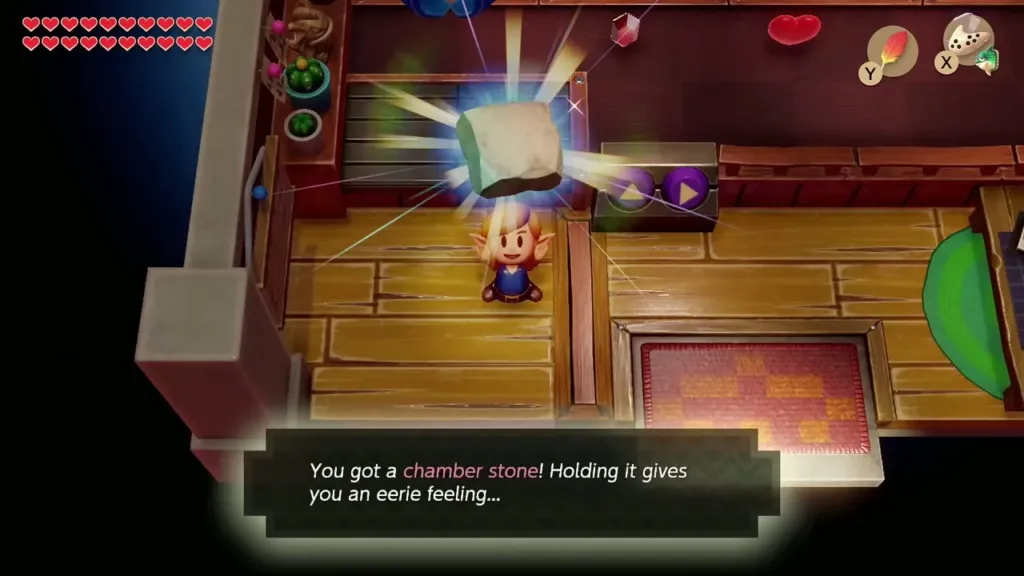 Link holding up the Chamber Stone with the message that he got it