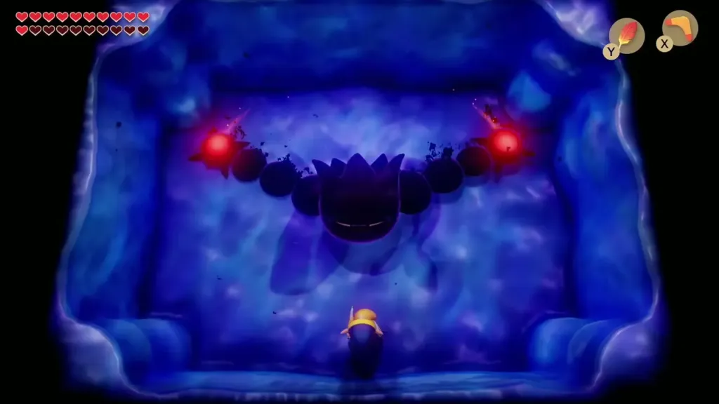 Dethl's dark segments stretched across the room with a glowing red hand at each end
