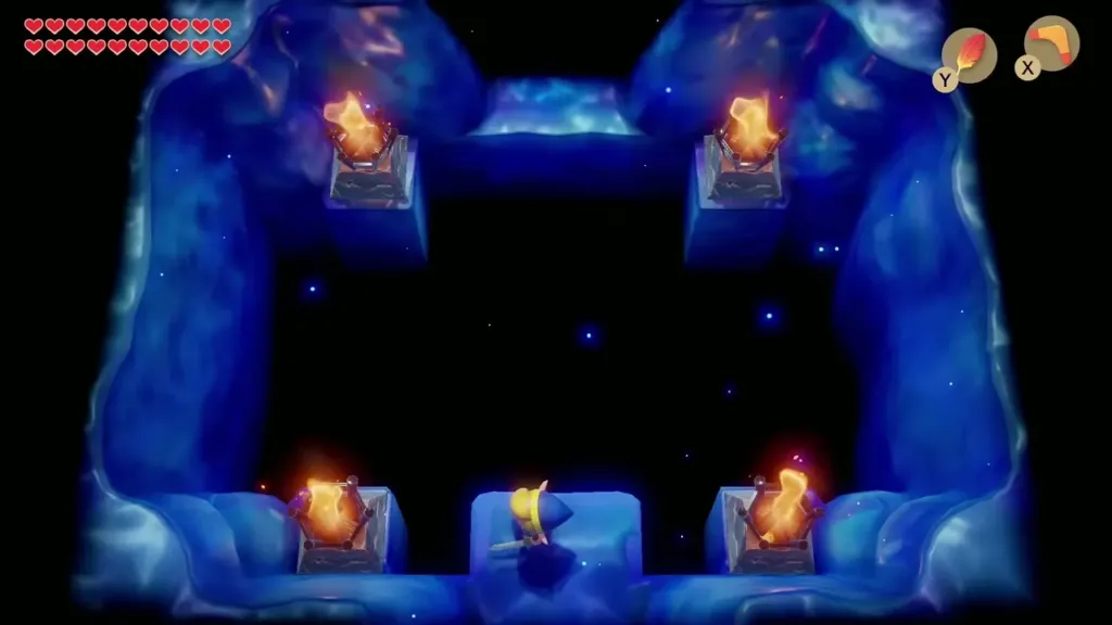 Link at the edge of a chamber with four torch pedestals around a dark abyss