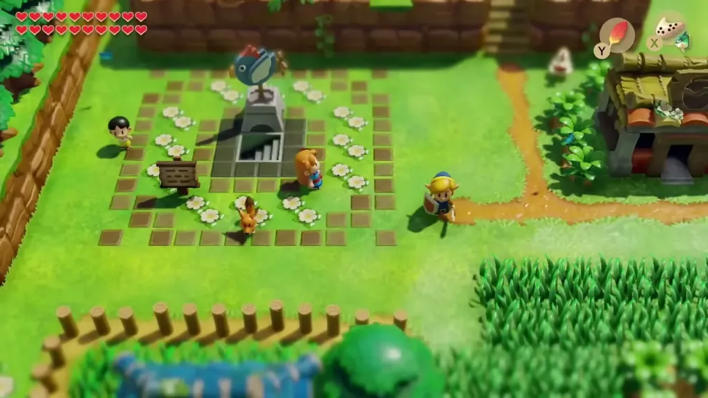 Link near the fish statue in Mabe Village with villagers