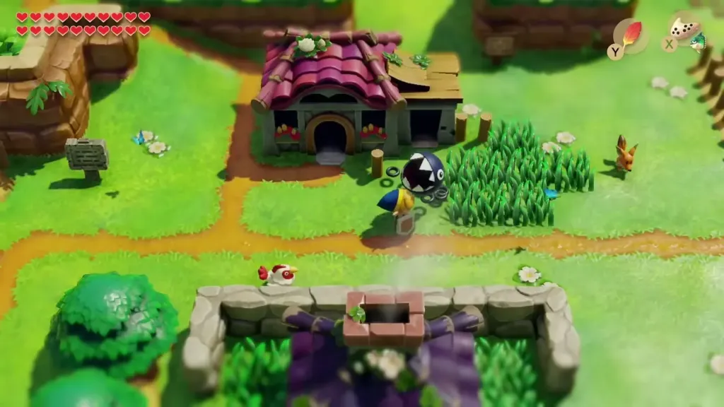 Link walking through Mabe Village past the Town Tool Shop with Bow-Wow beside him