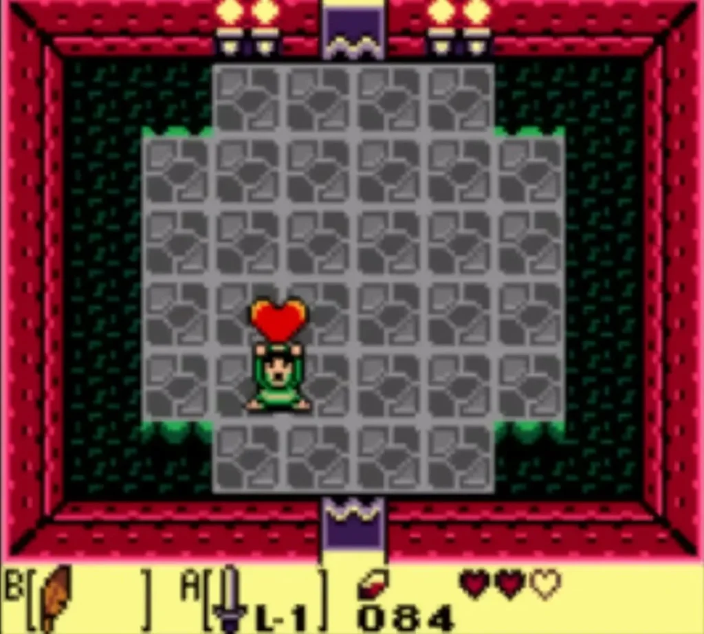 Link holds a Heart Container overhead in the Tail Cave arena after the worm falls
