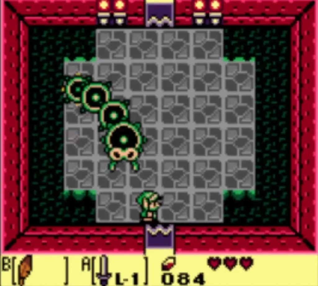 Moldorm stretched diagonally across the green-floored Tail Cave arena with Link at the south door