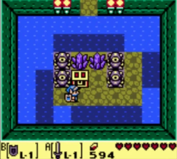 Round eye statues ring a chest in a watery room of Angler's Tunnel, with Link at the lower right Round eye statues ring a chest in a watery room of Angler's Tunnel, with Link at the lower right