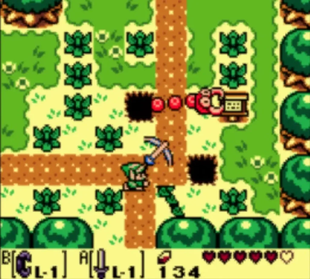 A red crawling creature emerges from a hole beside the path as Link swings his Sword A red crawling creature emerges from a hole beside the path as Link swings his Sword
