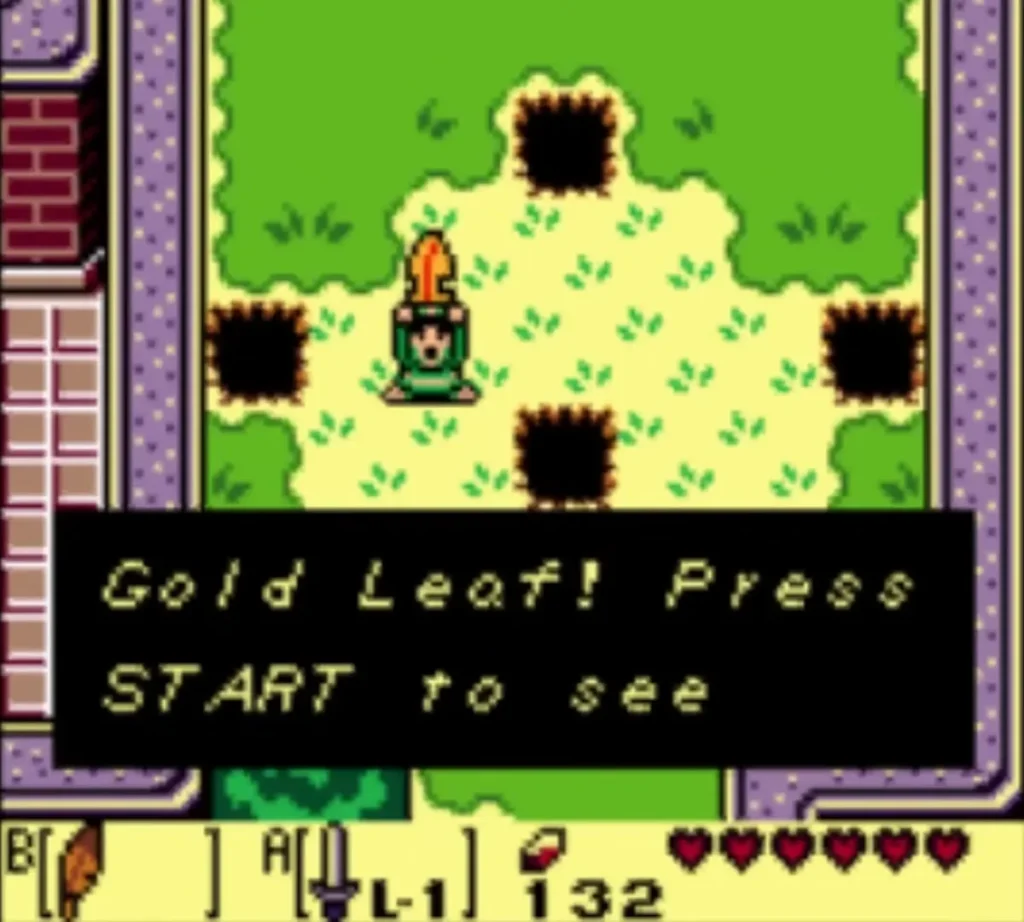Link holds up the Gold Leaf in the hole field with the message box fully typed Link holds up the Gold Leaf in the hole field with the message box fully typed