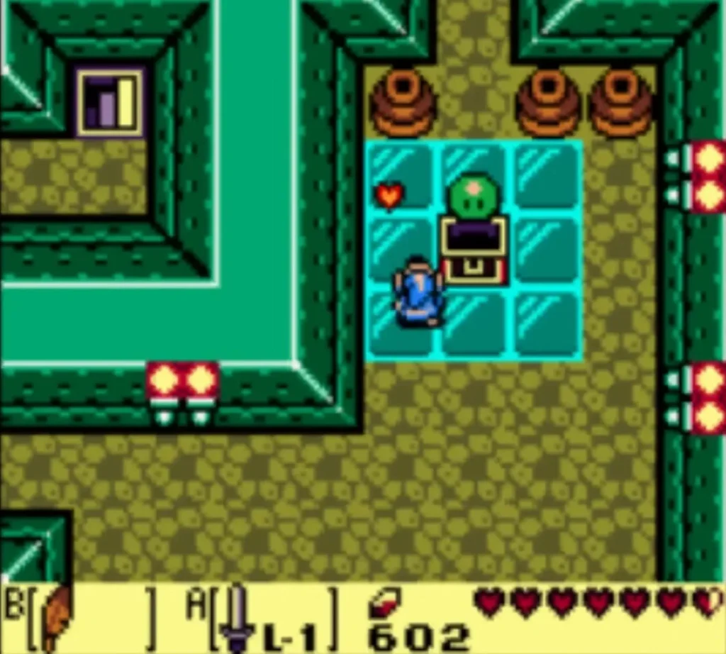 A Green Zol jumping up out of the opened chest in Angler's Tunnel as Link stands beside it A Green Zol jumping up out of the opened chest in Angler's Tunnel as Link stands beside it