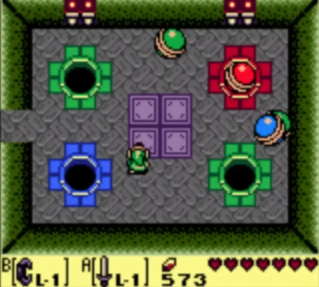 Link stands among the orb monsters and four colored holes of the orb room Link stands among the orb monsters and four colored holes of the orb room