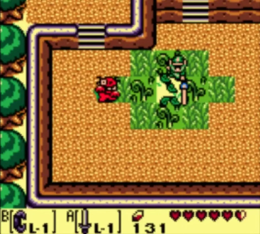 Link in a grass patch on the sand while a red Spiny Beetle crawls out beside him Link in a grass patch on the sand while a red Spiny Beetle crawls out beside him
