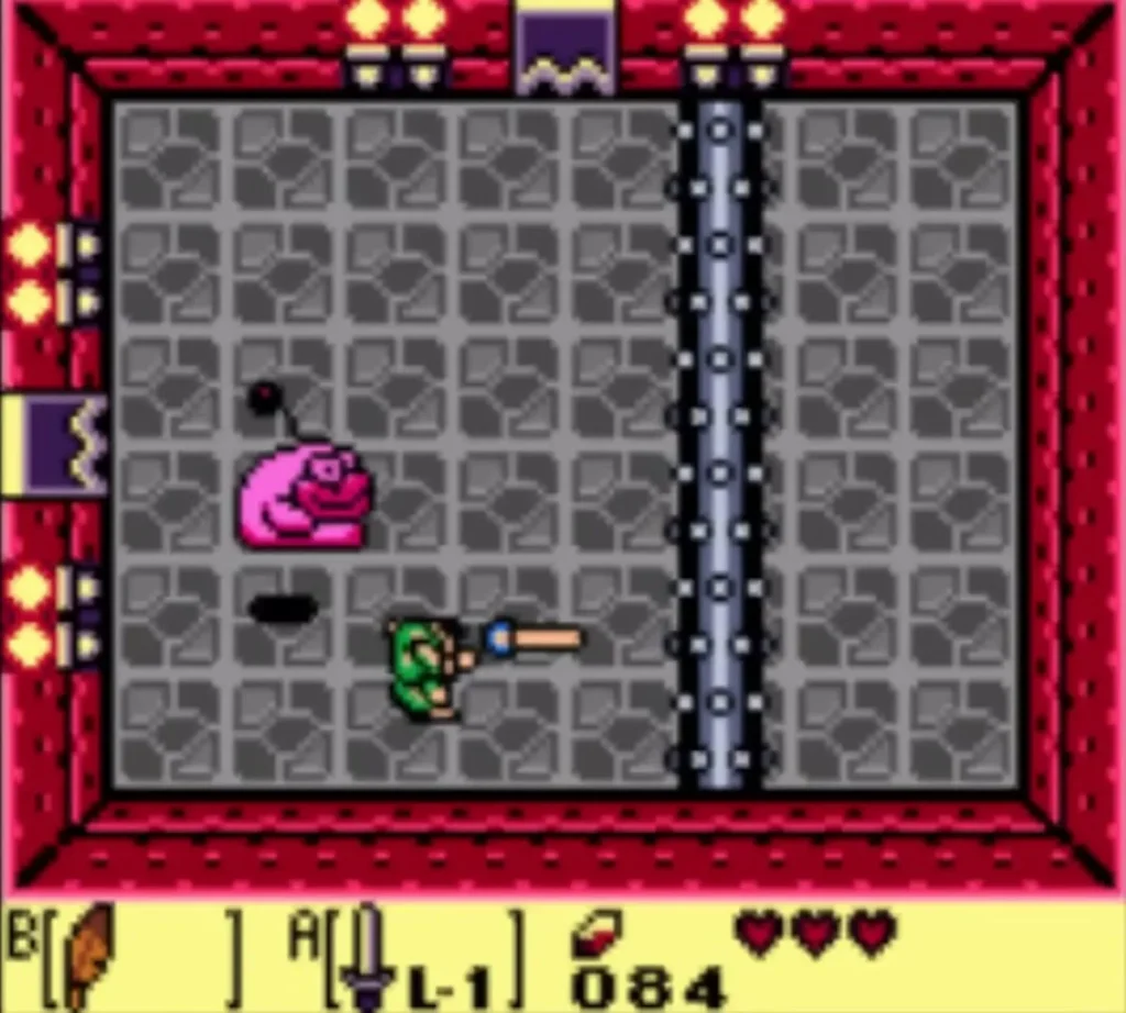Link with his sword extended in a stone dungeon room, pink Rolling Bones up and to the left Link with his sword extended in a stone dungeon room, pink Rolling Bones up and to the left