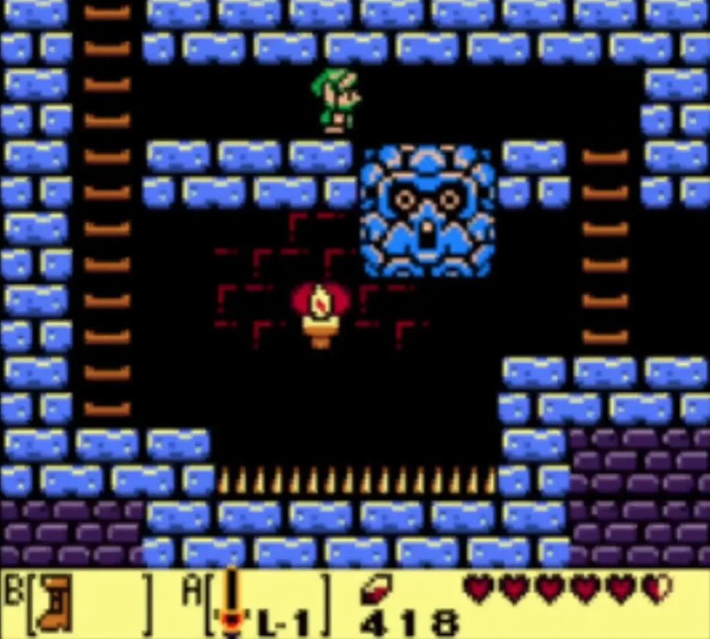 Blue Mega Thwomp hanging above a row of spikes in a side-view Key Cavern passage, with Link at the top Blue Mega Thwomp hanging above a row of spikes in a side-view Key Cavern passage, with Link at the top