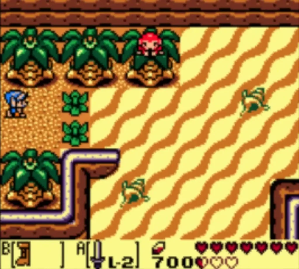 A red Monkey peeks out of a palm tree on Toronbo Shores while Link stands on the sand below A red Monkey peeks out of a palm tree on Toronbo Shores while Link stands on the sand below