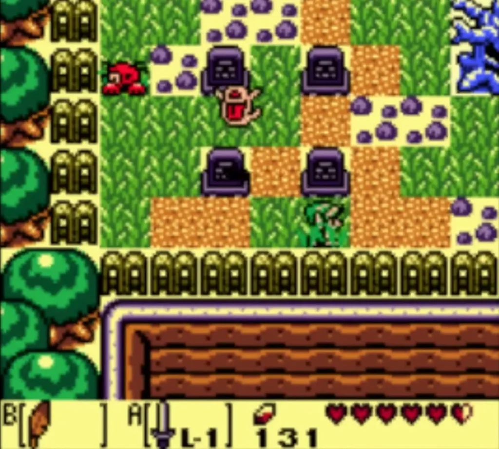 A red Spiny Beetle crawling through tall grass beside a patch of purple rocks A red Spiny Beetle crawling through tall grass beside a patch of purple rocks