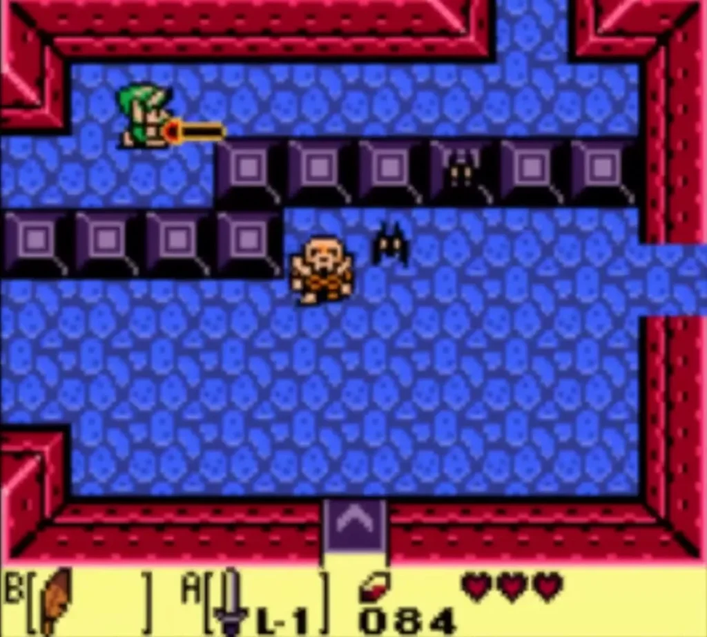 Link thrusts his Sword along a row of blocks as an orange Stalfos stands below in a Tail Cave room Link thrusts his Sword along a row of blocks as an orange Stalfos stands below in a Tail Cave room