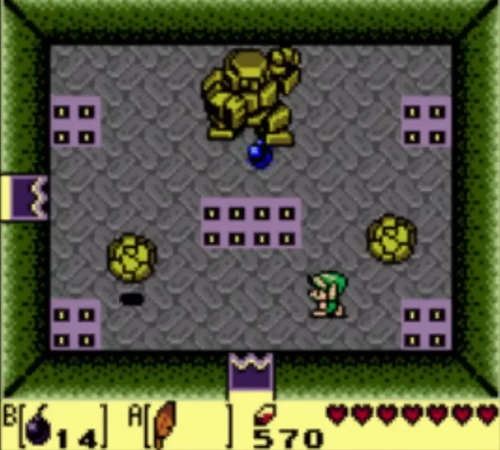 Stone Hinox on the grey floor with a blue ball near its feet and purple spike tiles around the arena Stone Hinox on the grey floor with a blue ball near its feet and purple spike tiles around the arena