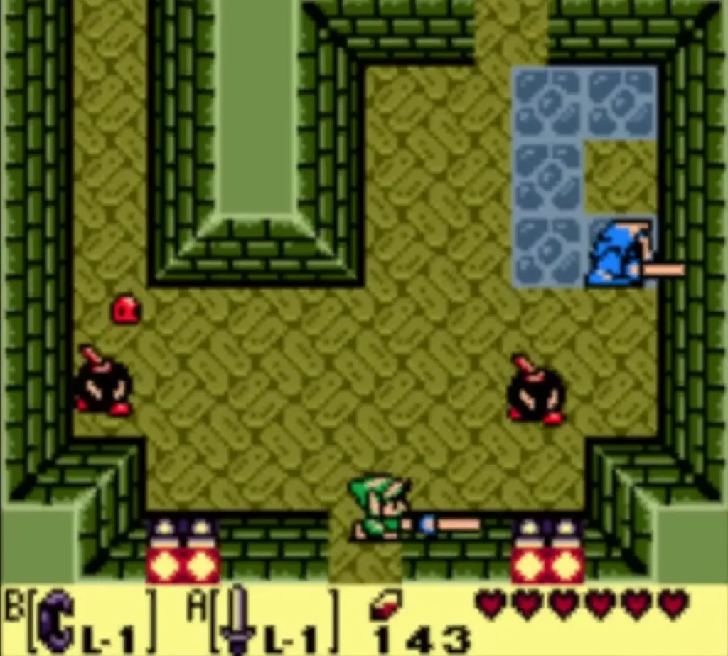 The Sword Stalfos beside two black Bombites in the Key Cavern room while Link thrusts his Sword The Sword Stalfos beside two black Bombites in the Key Cavern room while Link thrusts his Sword