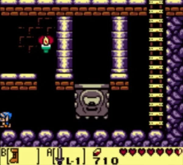 A grey Thwomp hangs above a torch-lit Angler's Tunnel room with Link at the left A grey Thwomp hangs above a torch-lit Angler's Tunnel room with Link at the left