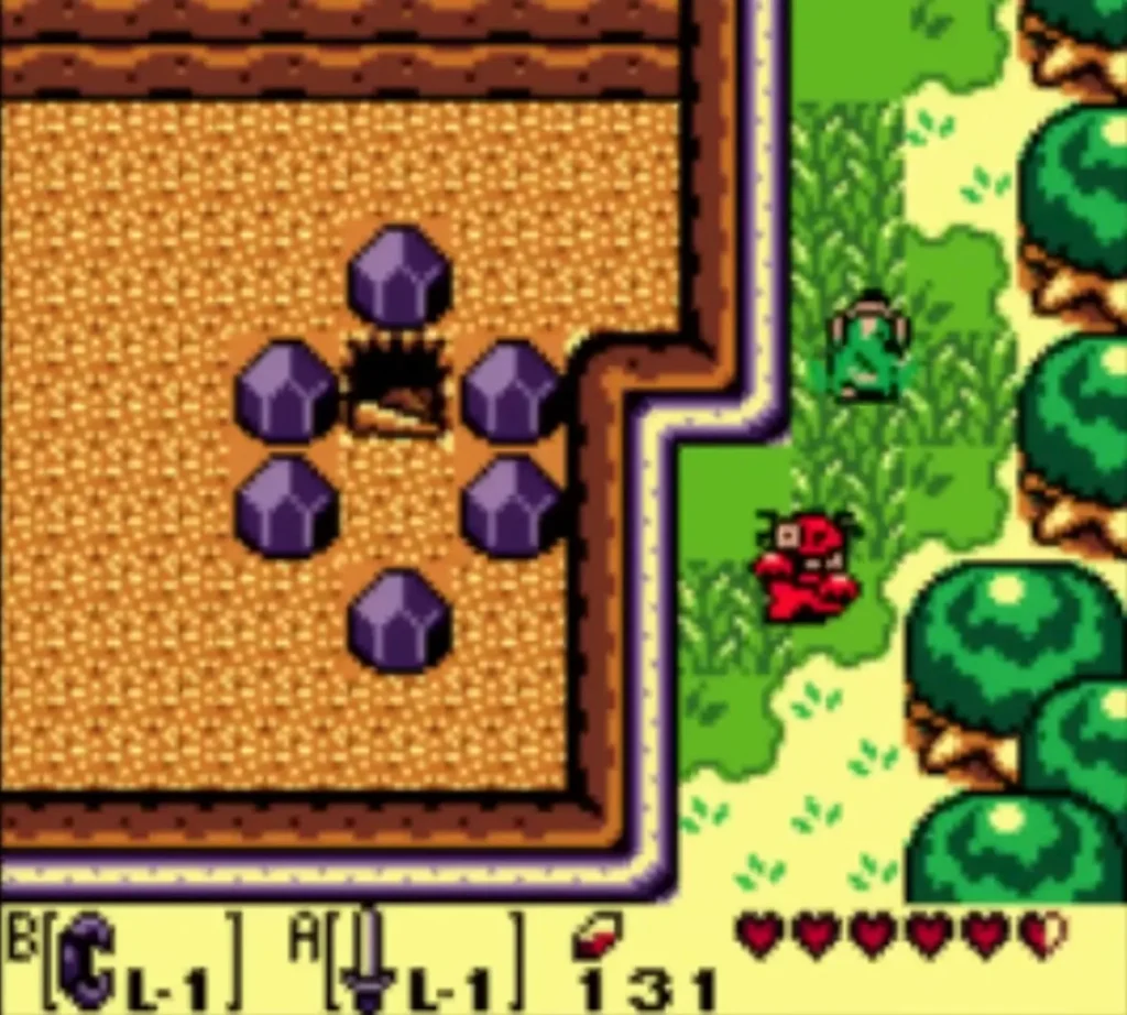 A red Zombie climbs out of the grass beside Link next to a ring of purple boulders A red Zombie climbs out of the grass beside Link next to a ring of purple boulders